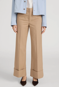 Beige pants worn with a light blue jacket on a white background