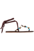 Brown sandal with beaded straps on a white background