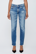 Blue jeans worn by a person on a white background
