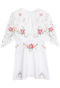 White short-sleeve embroidered dress with pink and orange floral motifs and green leaves, featuring a split neckline and lace trim on the sleeves.