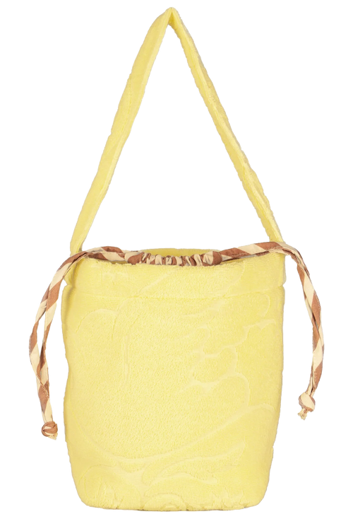 A light yellow woven bucket bag with a single shoulder strap and a brown and beige patterned drawstring closure at the top, shown against a plain white background.