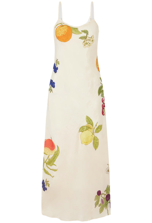 An off-white sleeveless maxi dress with a colorful fruit and floral print, featuring thin shoulder straps, shown against a plain white background.