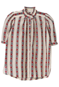 A short-sleeve button-up blouse with vertical stripes of red roses and black-and-white geometric patterns on a cream background.