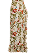 A high-waisted, ruffled maxi skirt with a dense floral and bird print on an off-white base, featuring green leaves, pink and red flowers, and small blue birds.