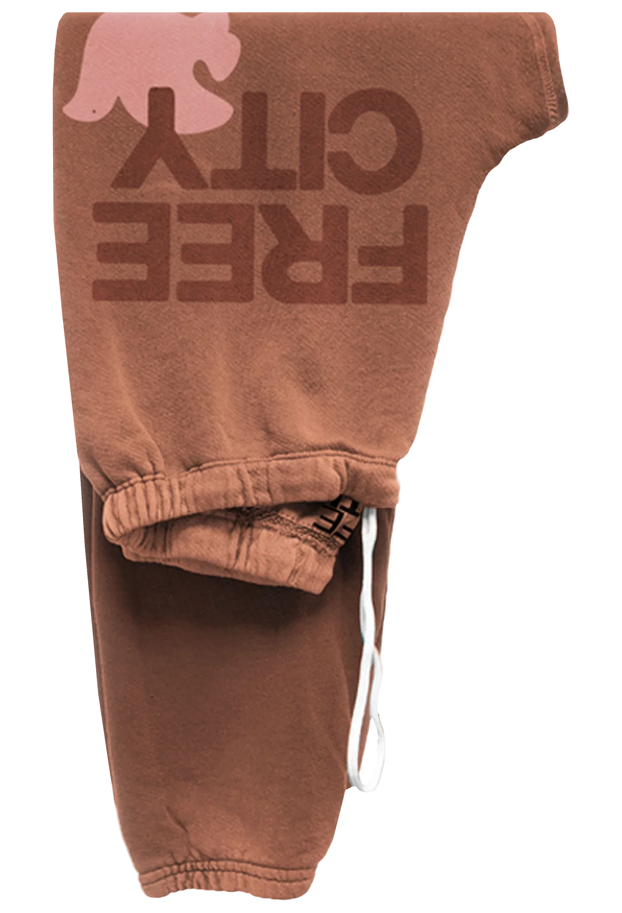 A pair of brown sweatpants featuring a large 'FREE CITY' graphic in dark brown on the upper leg, a pink dove silhouette above it, and a white drawstring at the elastic waistband.