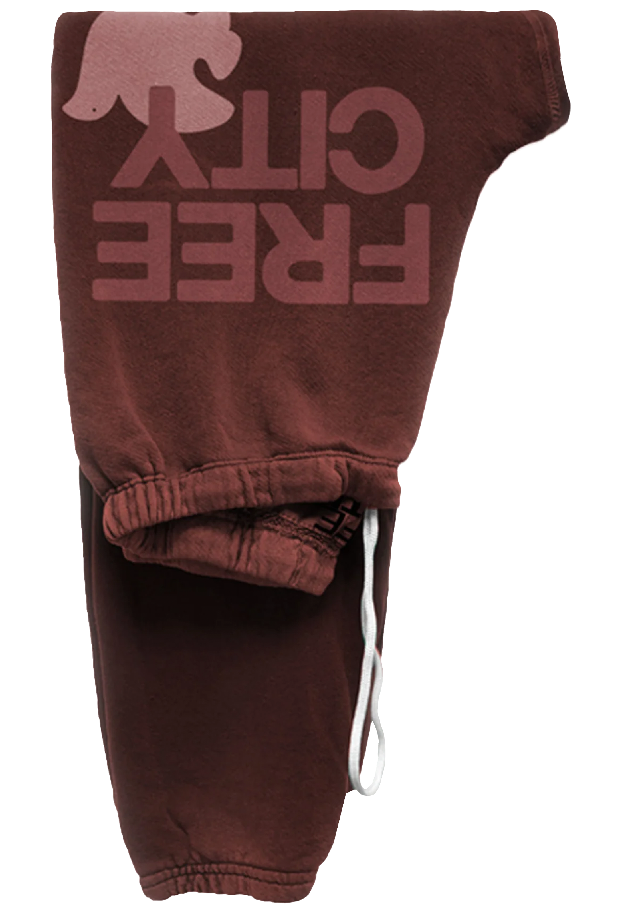 A pair of dark brown sweatpants featuring a large, faded pinkish-brown graphic on the upper leg that reads 'FREE CITY' alongside a silhouette of a dove. The pants have an elasticized ankle cuff with a white drawstring.