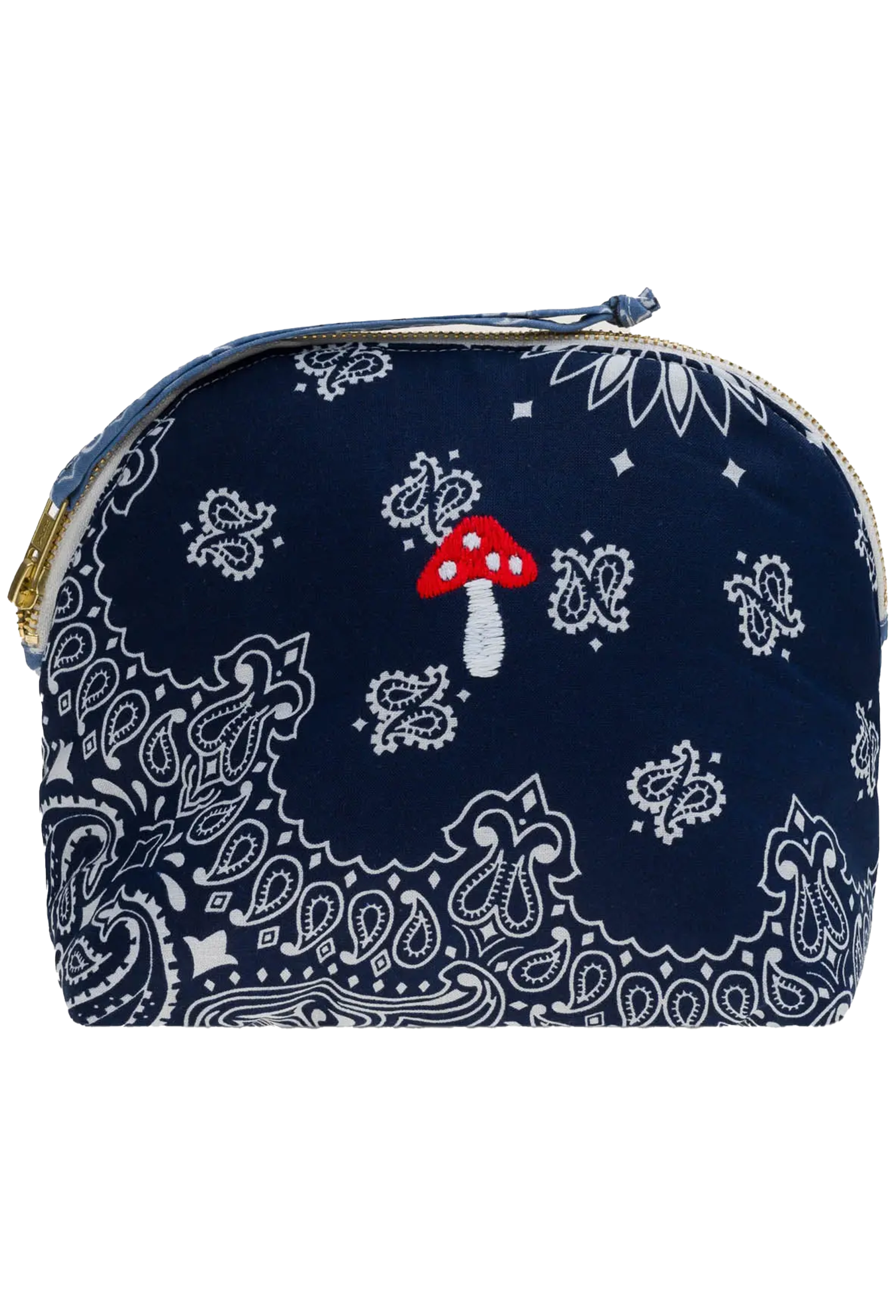 A small zippered pouch or cosmetic bag in navy blue bandana fabric with white paisley and floral motifs, plus a small embroidered red-and-white mushroom on the front.