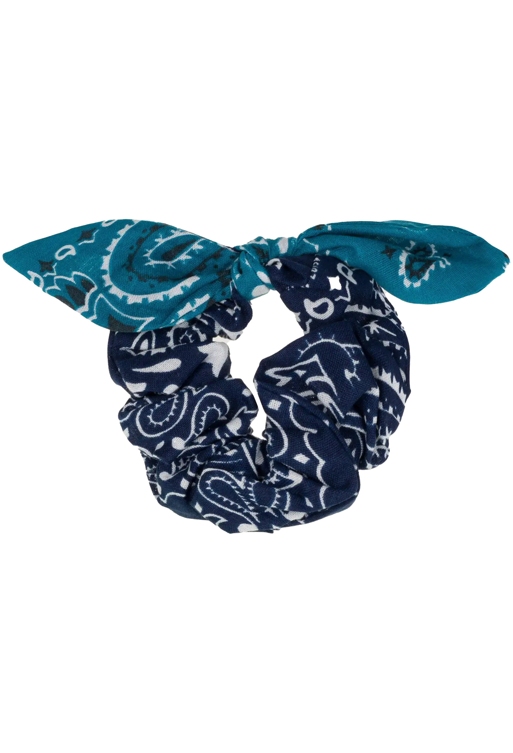 A fabric scrunchie styled as a bow, featuring a navy blue and white paisley pattern on the main body and a solid teal blue patterned bandana on the bow ends, shown against a plain white background.