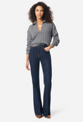 A woman modeling a gray cable-knit V-neck sweater and dark blue high-waisted flare jeans against a light gray studio background.