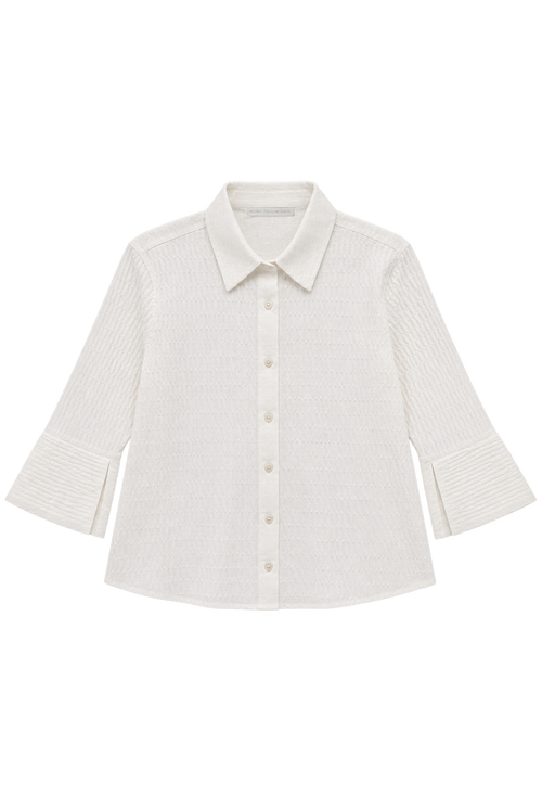 An off-white textured long-sleeve button-up shirt with a classic collar and buttoned cuffs, displayed flat against a solid white background.