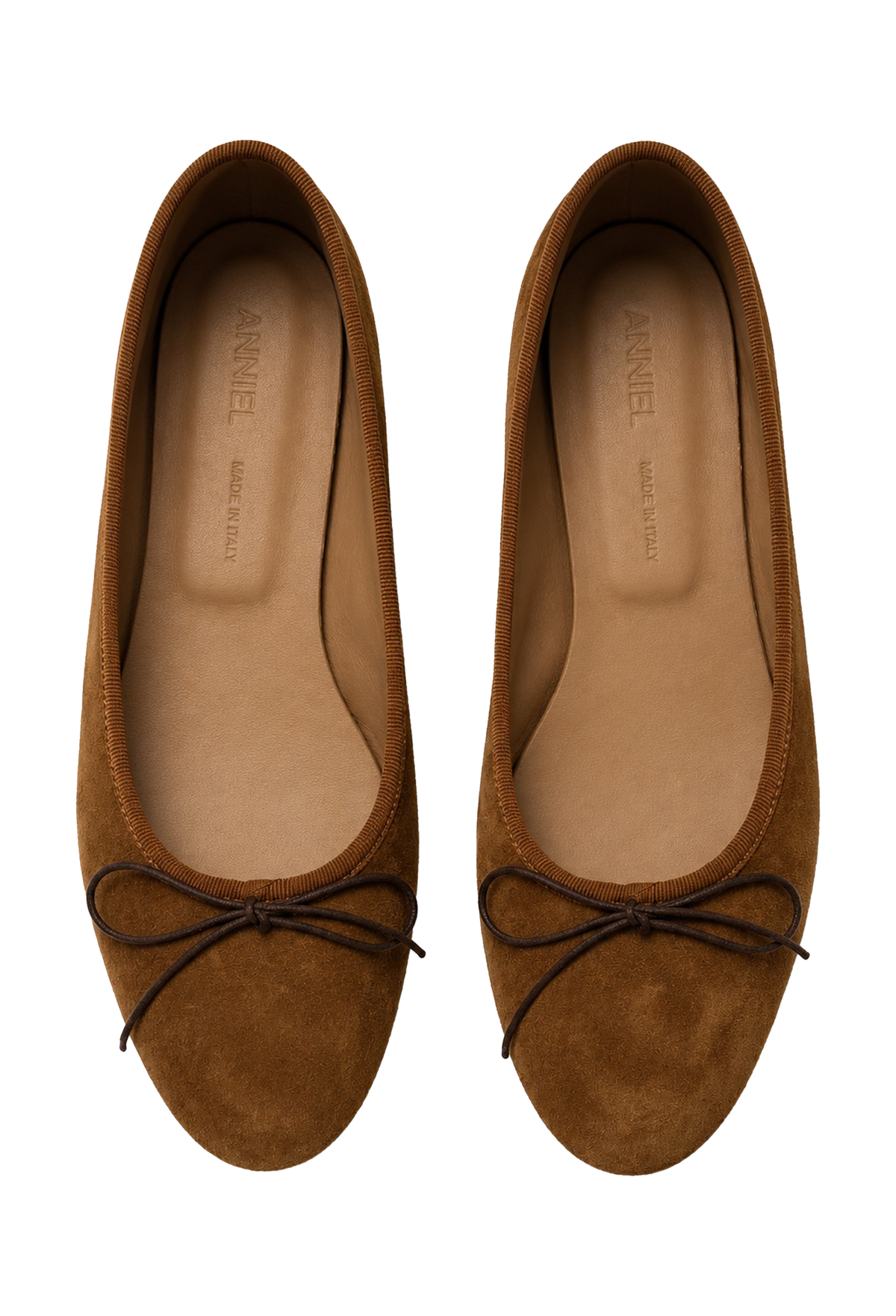 A pair of brown suede ballet flats with dark brown ribbon bows on the toes, shown from a top-down view on a white background. The insoles are tan and feature the brand name 'ANNIEL' printed inside.