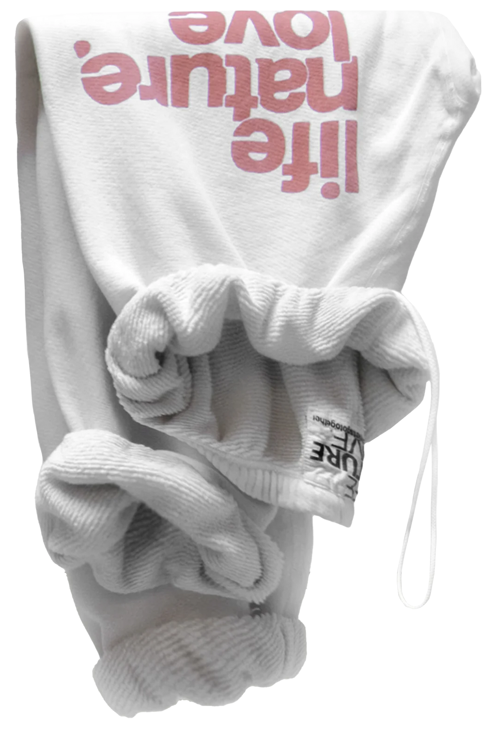 White ribbed knit baby sweatpants with a large pink 'life nature. love' graphic on the back, folded to show the texture and drawstring closure.