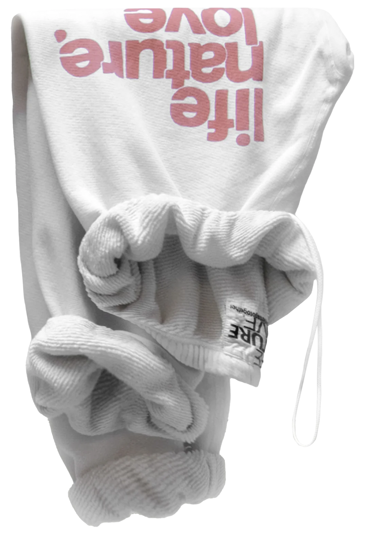 White ribbed knit baby sweatpants with a large pink 'life nature. love' graphic on the back, folded to show the texture and drawstring closure.