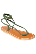 Green strap thong sandal with small gold ankle buckle and tan footbed. Set against a checkered background. 