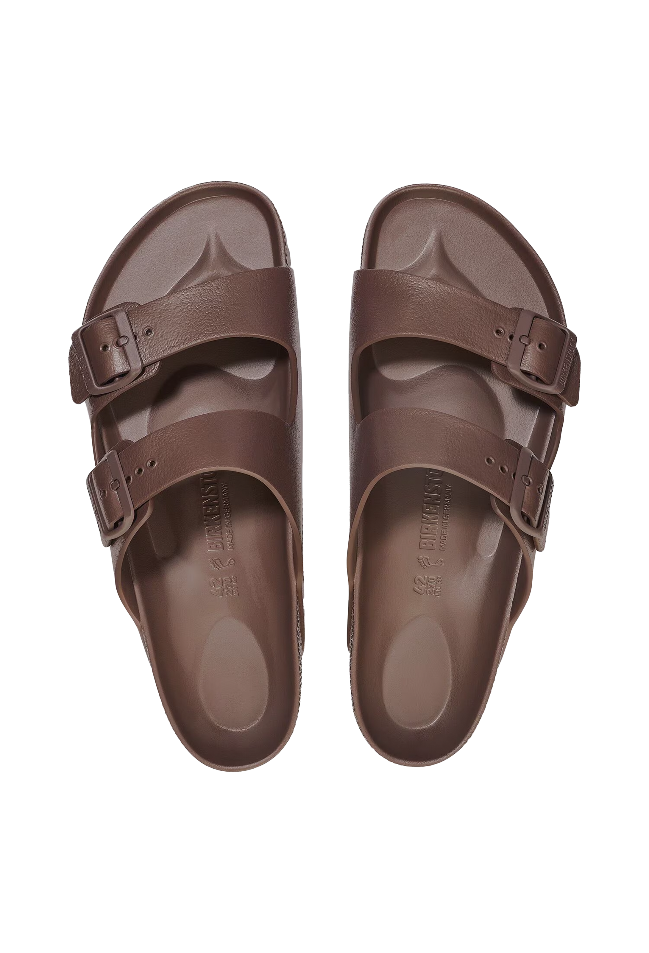 A pair of all-brown two strap buckle sandals. Transparent background