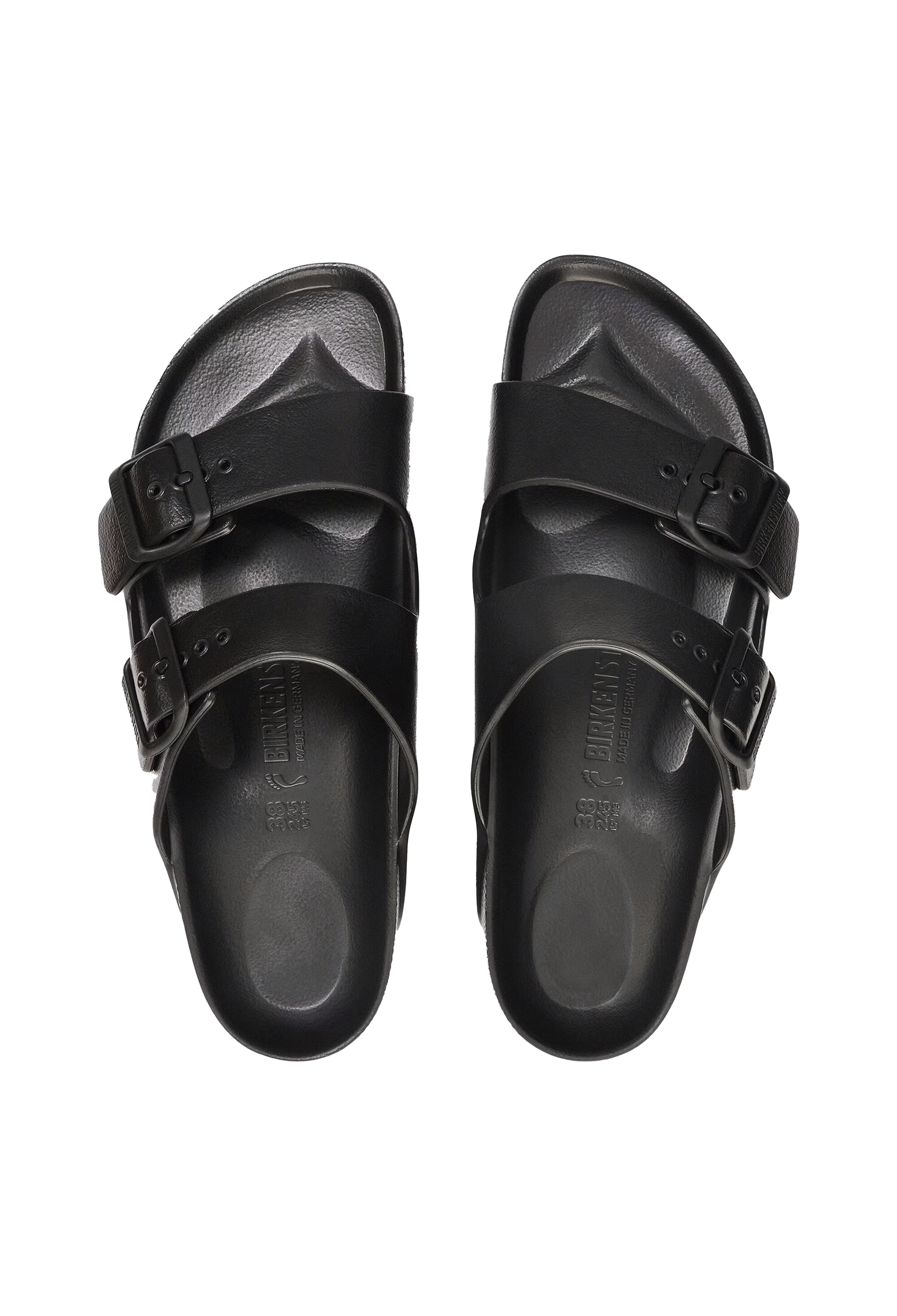 A pair of all-black two strap buckle sandals. Transparent background