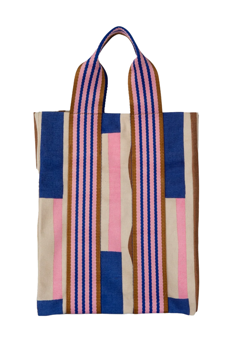A canvas tote bag with a brown, pink, and blue print on it. Transparent background.