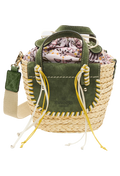 A mini basket bag with green leather flaps, yellow and white cord detailing, and two small leather handles and a crossbody strap. Transparent background.