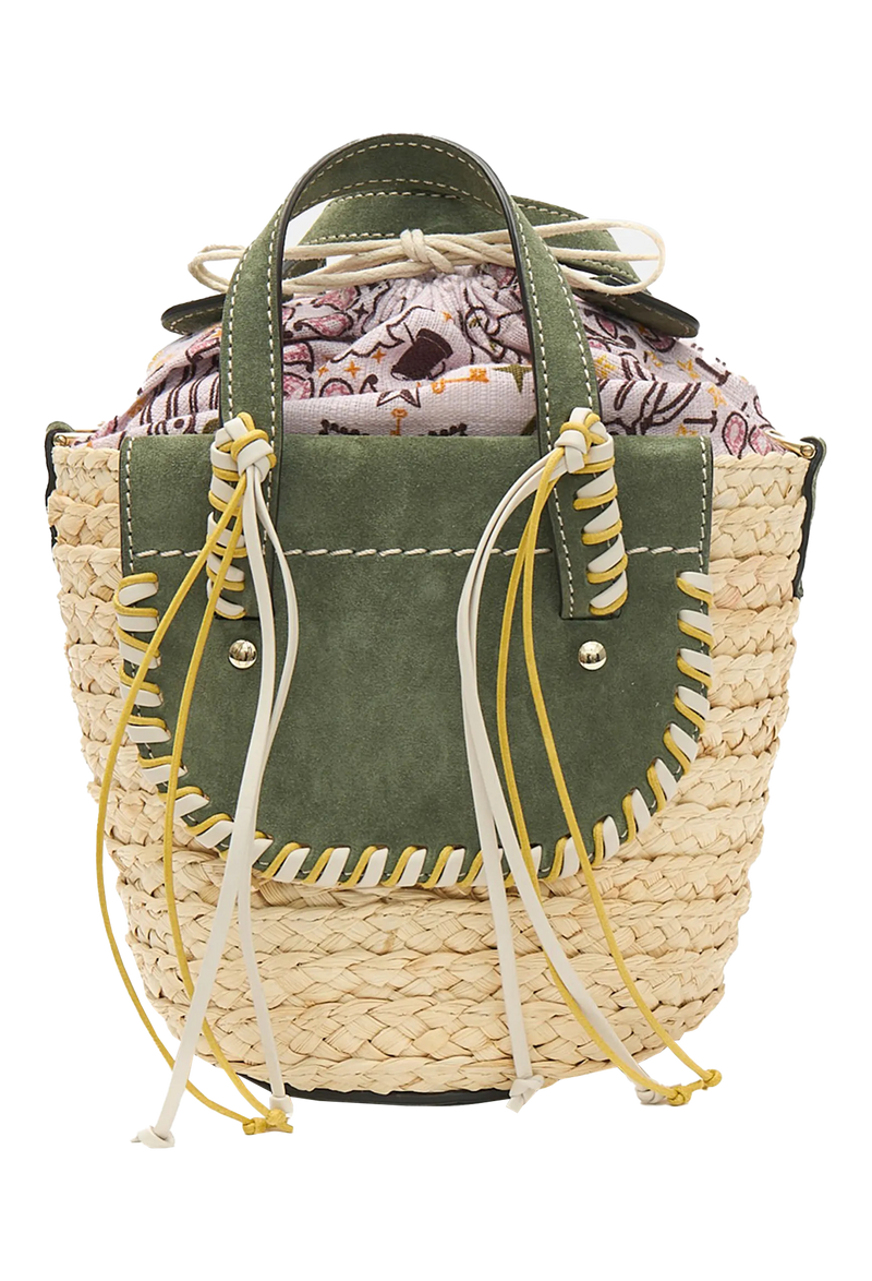 The back of a mini basket bag with green leather flaps, yellow and white cord detailing, and two small leather handles and a crossbody strap. Transparent background.