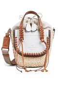 A mini basket bag with white leather flaps, brown cord detailing, and two small leather handles and a crossbody strap. Transparent background.