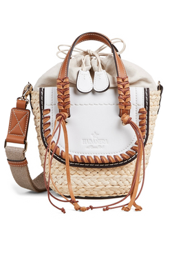 A mini basket bag with white leather flaps, brown cord detailing, and two small leather handles and a crossbody strap. Transparent background.