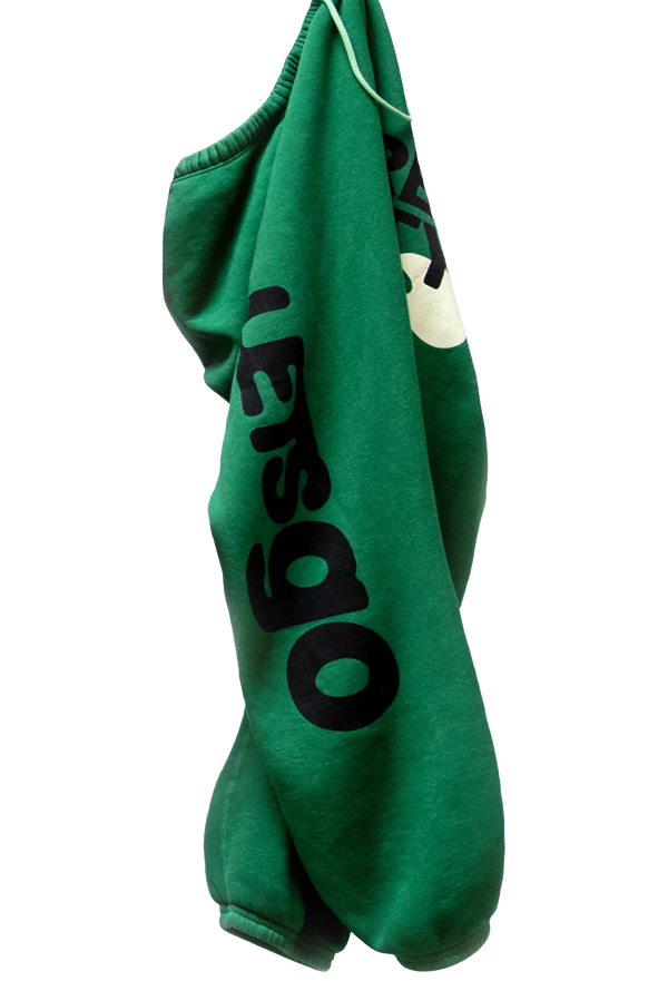 A pair of green sweatpants with letsgo printed in black lettering. Transparent background.