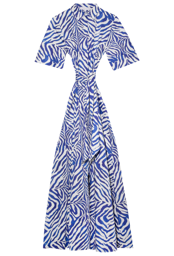 Blue and white long collared, belted dress with short sleeves up against a checkered background. 