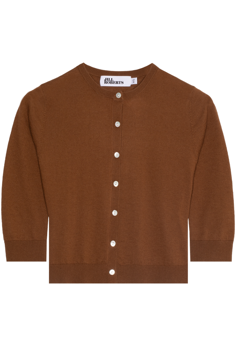 A rust brown cashmere cropped cardigan with seven shiny white buttons and 3/4 sleeves. Transparent background.