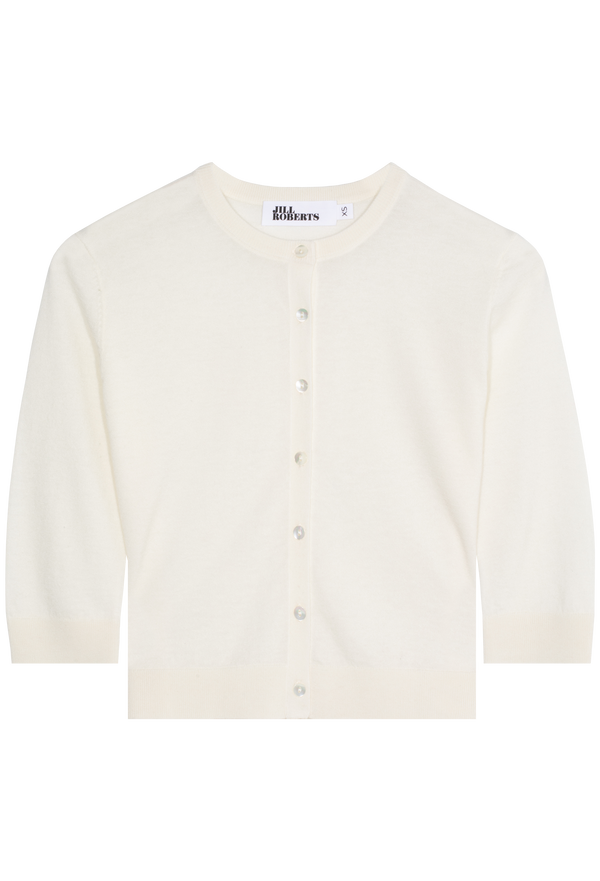 An eggshell cashmere cropped cardigan with seven shiny white buttons and 3/4 sleeves. Transparent background.