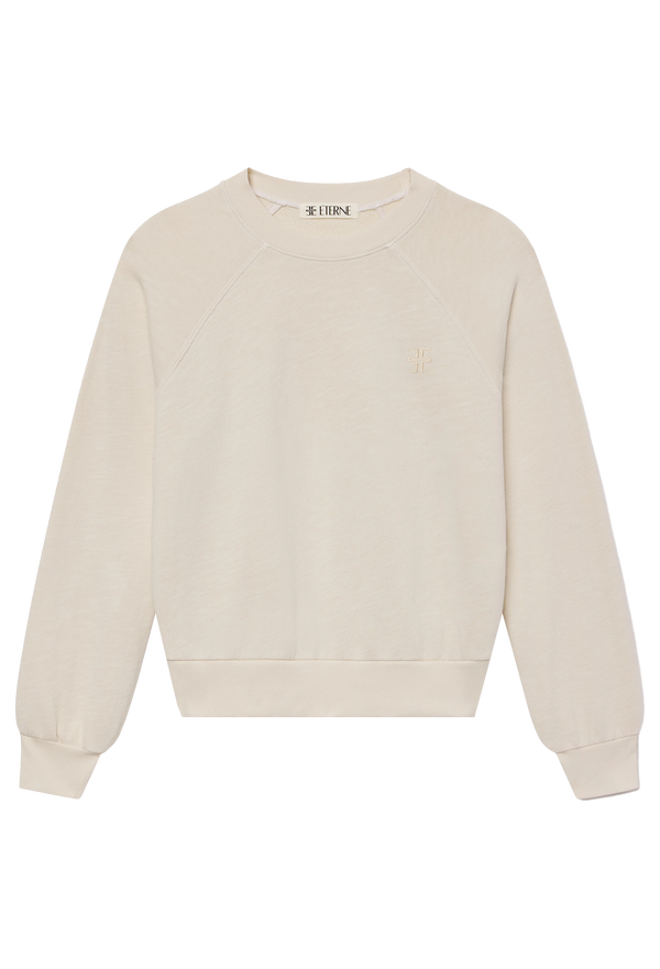 an off-white raglan sweatshirt. transparent background.