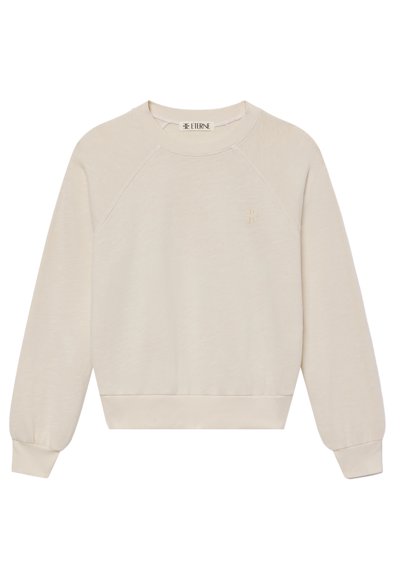 an off-white raglan sweatshirt. transparent background.