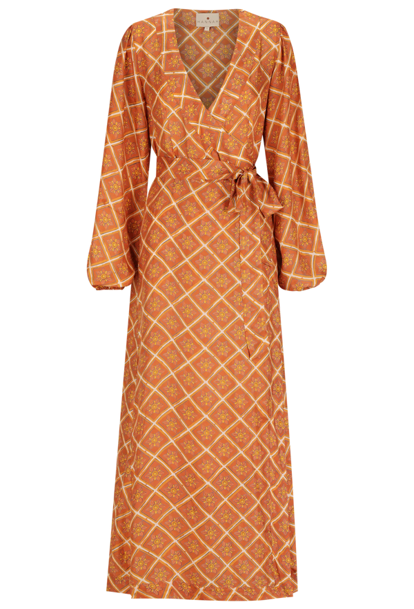 a rust brown maxi long sleeve wrap dress with a geometric sun print. transparent background.