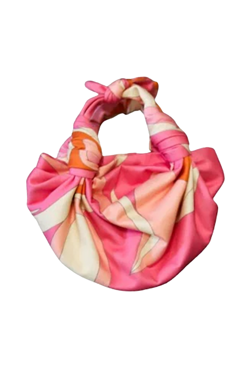 a pink knotted strap handbag with white and orange. transparent background.