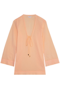 a melon colored deep v-neck mini coverup with long sleeves and a tie at the bust. transparent background.