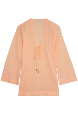 a melon colored deep v-neck mini coverup with long sleeves and a tie at the bust. transparent background.