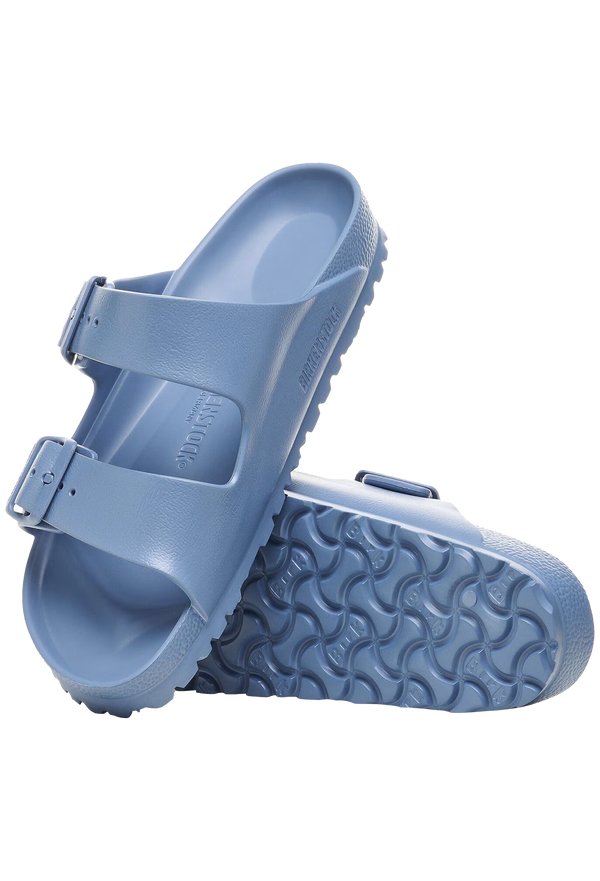 Blue sandal with double buckle straps on a transparent background