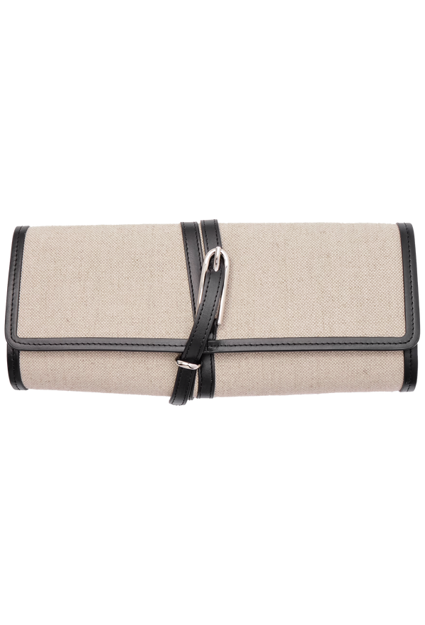 an off-white canvas belted clutch with black leather trim and a silver buckle on a transparent background.