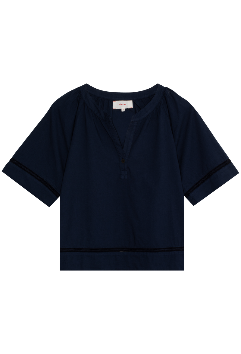 Navy blue short-sleeve v-neck button closure top with embroidery trim detail on a transparent background.