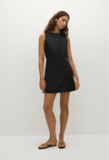 model wearing a black sleeveless mini dress on a white background