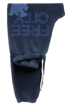 dark blue sweatpants with blue 'FREECITY' text and light blue dove logo on a transparent background