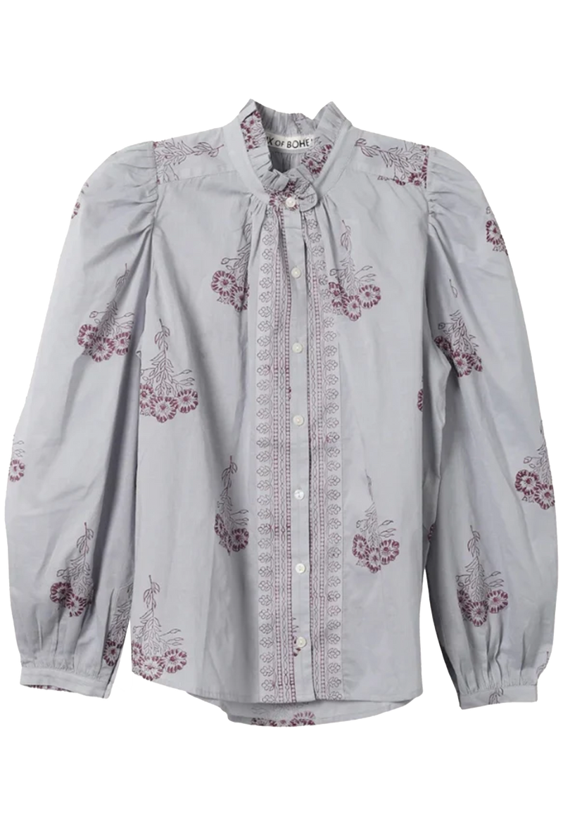 Light blue blouse with floral embroidery on a transparent background