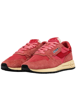 pink and red athletic tennis shoes with a black bottom