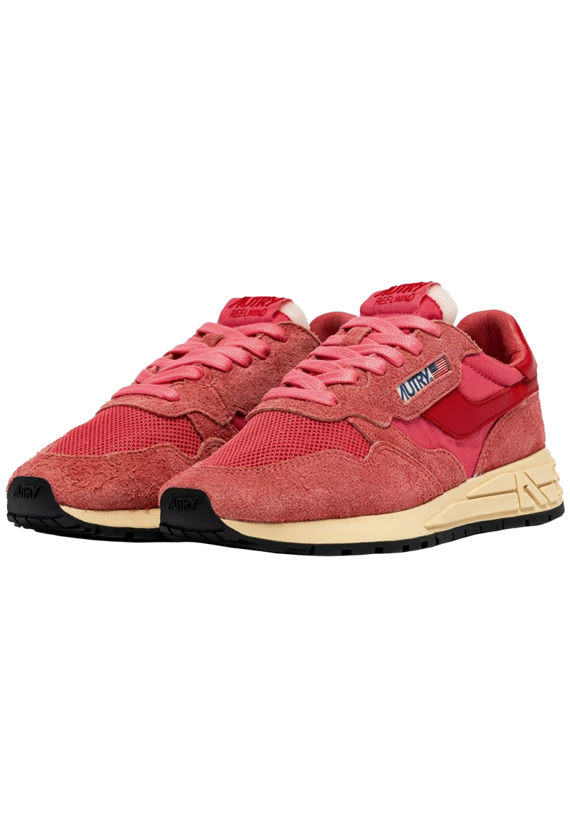 pink and red athletic tennis shoes with a black bottom