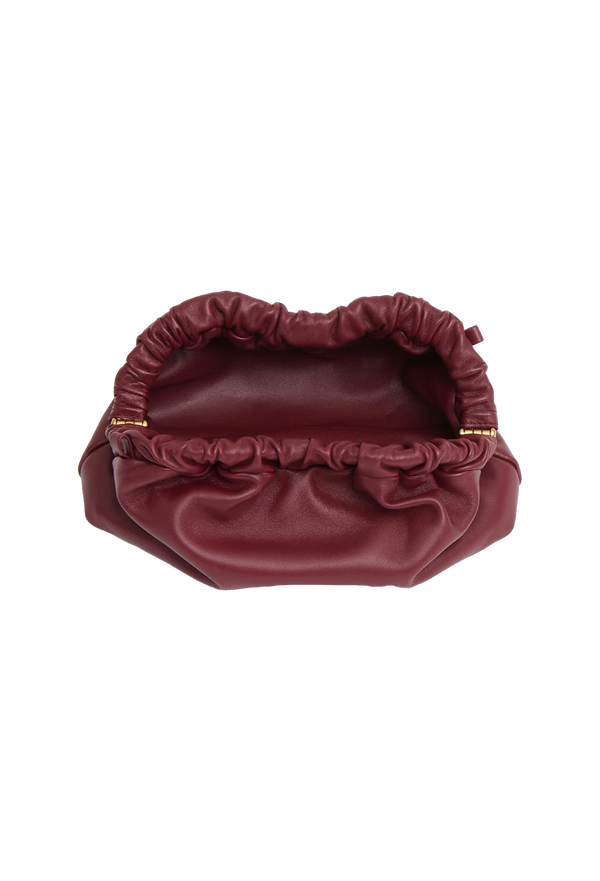 a red leather clutch bag. transparent background.