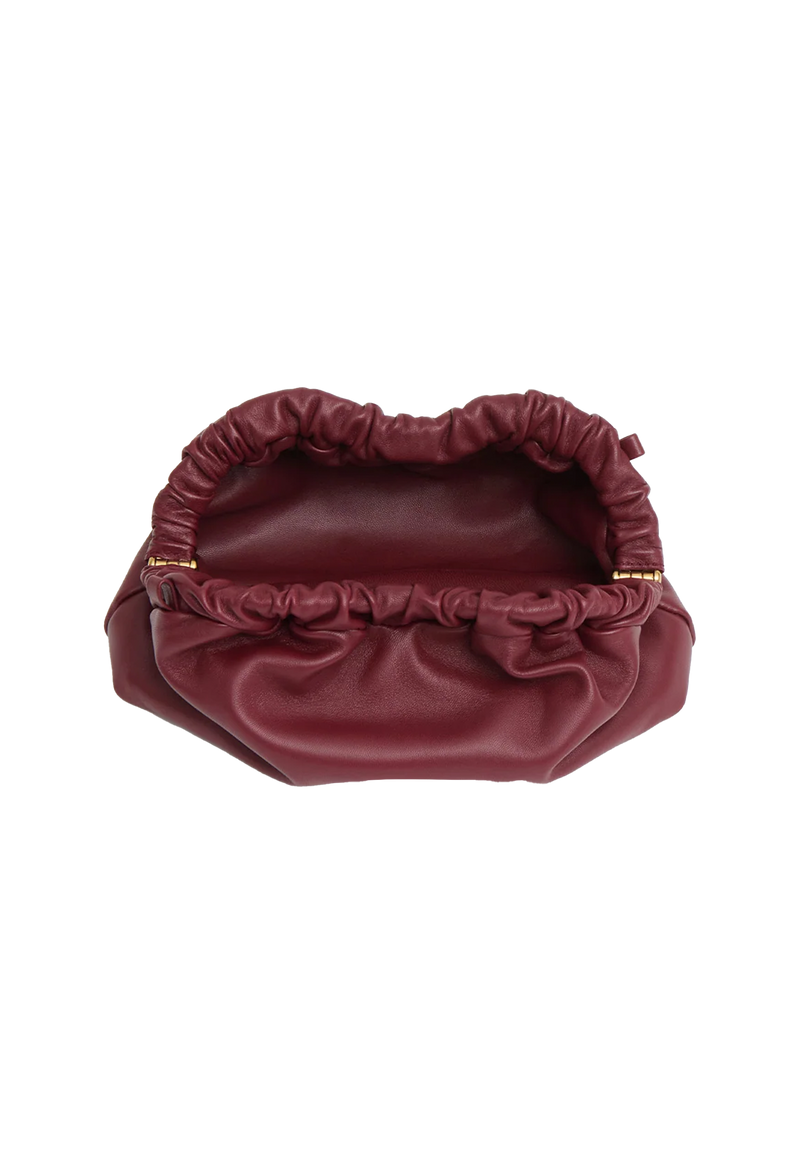 a red leather clutch bag. transparent background.