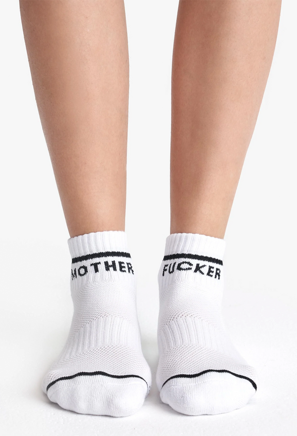 White socks with black MOTHER FUCKER text on a white background