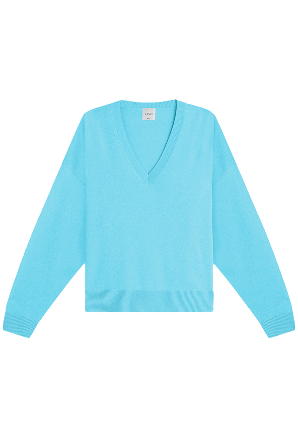 an oversized cool blue v-neck sweater with dropped shoulders. transparent background