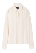 Long sleeve ivory button down blouse with pointed collar. Set against checkered background. 