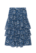 A blue tiered skirt with a white and light blue floral print, shown flat against a solid white background.