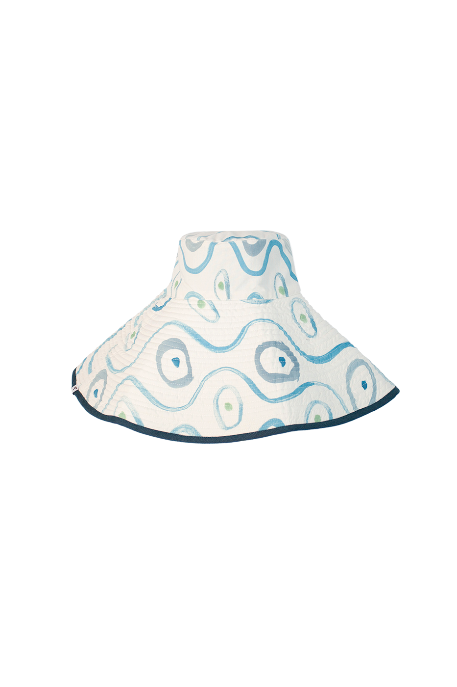 Reversible hand painted bucket hat, white with blue painted designs and blue rim. Set against black checkered background.